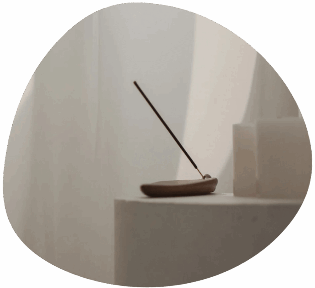 Home 1 incense stick placed in a holder on a white table